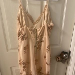 There is no brand but this dress is a size XS. it is tan with sequins